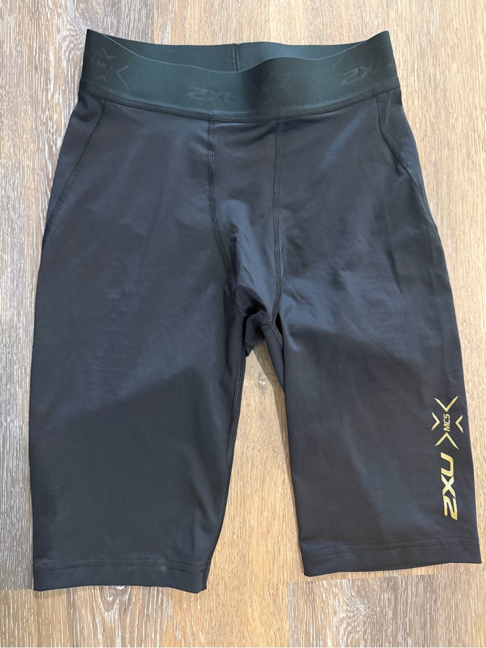 2XU Black Compression Cycling Shorts with Gold Logo Accent